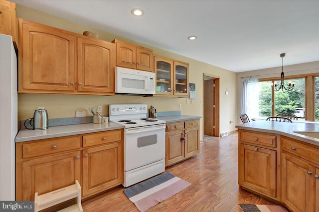 96 Gunhart Rd, Mohnton, PA 19540 - kitchen with white appliances, light wood finished floors, glass insert cabinets, decorative light fixtures, and light countertops