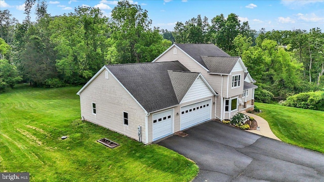 96 Gunhart Rd, Mohnton, PA 19540 - view of front facade featuring a garage, a front lawn, roof with shingles, and asphalt driveway