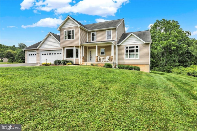 96 Gunhart Rd, Mohnton, PA 19540 - view of front of home with a porch, asphalt driveway, a garage, and a front yard