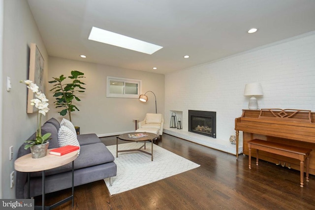 2301 N Tracy St, Alexandria, VA 22311 - living area featuring a skylight, a brick fireplace, wood finished floors, and recessed lighting