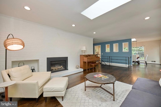 2301 N Tracy St, Alexandria, VA 22311 - living area with wood finished floors, recessed lighting, and a brick fireplace