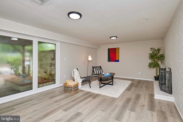 2301 N Tracy St, Alexandria, VA 22311 - living area featuring wood finished floors and a brick fireplace