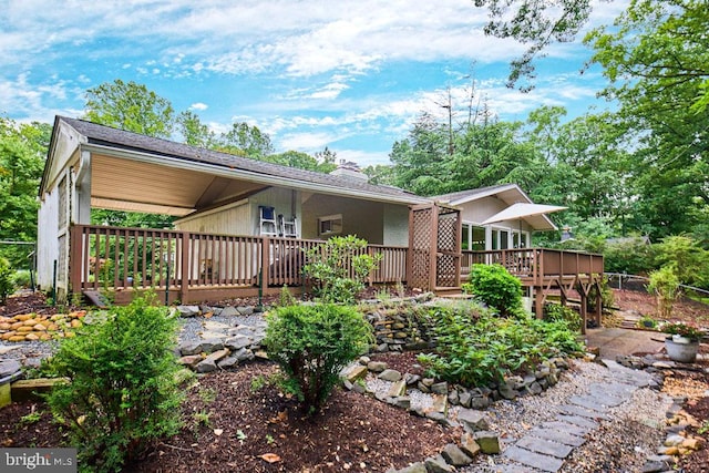 2301 N Tracy St, Alexandria, VA 22311 - rear view of house with a wooden deck and a chimney