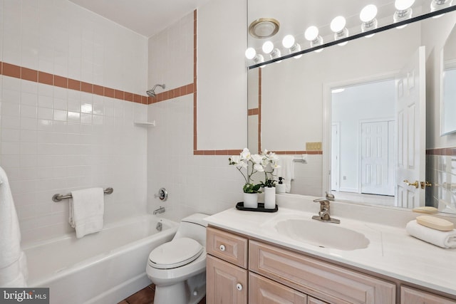 9309 Bells Mill Rd, Potomac, MD 20854 - bathroom featuring shower / tub combination, vanity, and tile walls