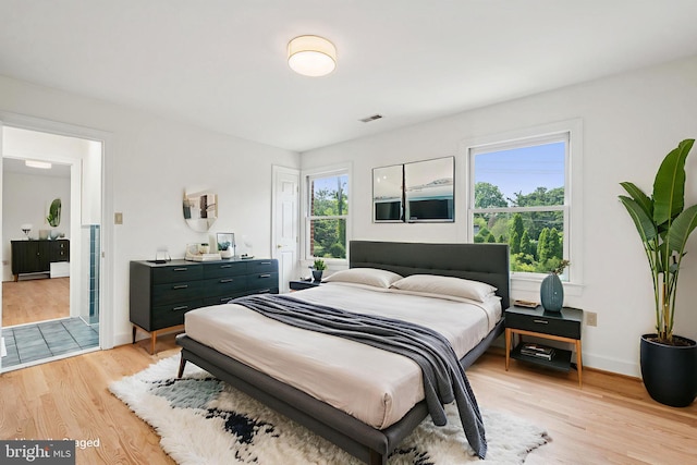9309 Bells Mill Rd, Potomac, MD 20854 - bedroom featuring light wood-style flooring and baseboards