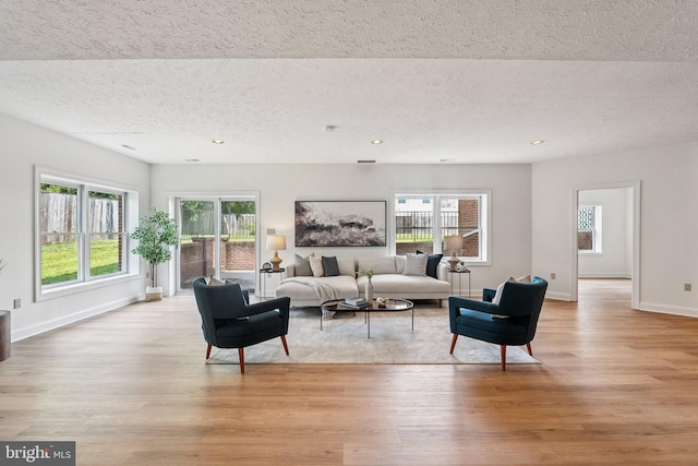 9309 Bells Mill Rd, Potomac, MD 20854 - living room with a textured ceiling, light wood finished floors, and recessed lighting