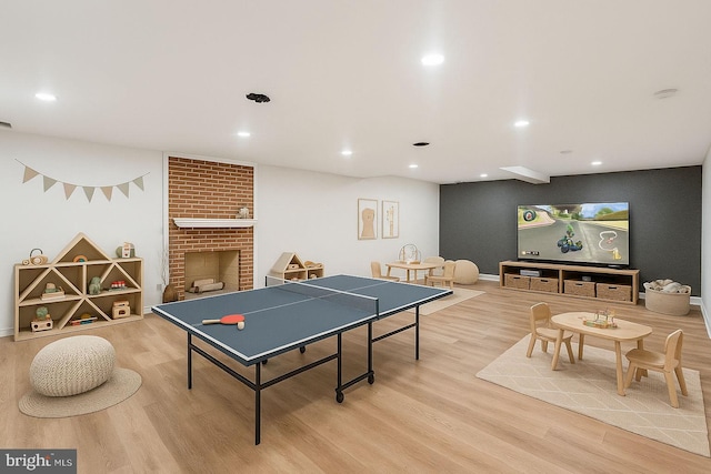 9309 Bells Mill Rd, Potomac, MD 20854 - rec room featuring wood finished floors, recessed lighting, and a fireplace