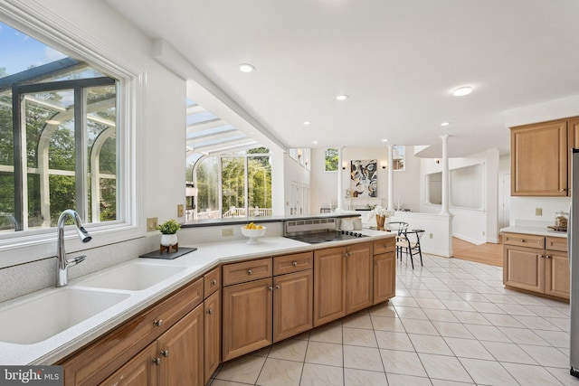 9309 Bells Mill Rd, Potomac, MD 20854 - kitchen featuring plenty of natural light, black electric cooktop, light countertops, recessed lighting, and light tile patterned flooring