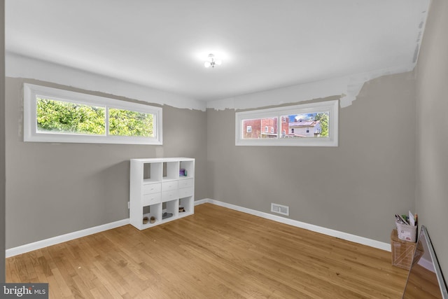 2306 Louise Ave, Baltimore, MD 21214 - spare room with wood finished floors and healthy amount of natural light