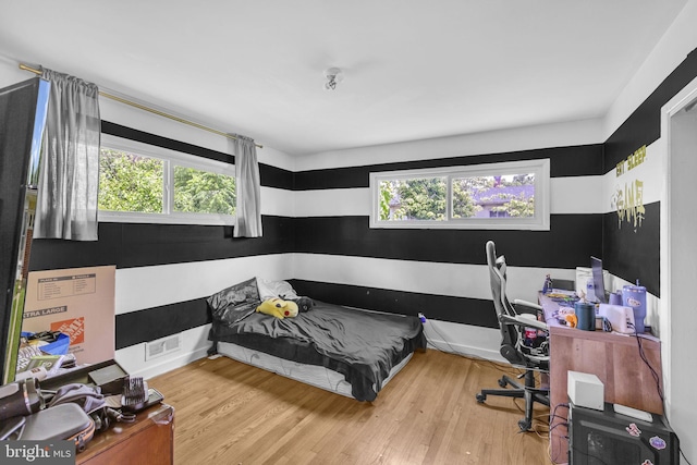2306 Louise Ave, Baltimore, MD 21214 - bedroom featuring wood finished floors and multiple windows