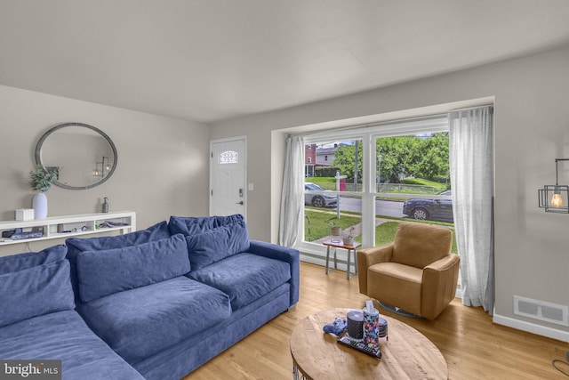 2306 Louise Ave, Baltimore, MD 21214 - living room with light wood-style floors and baseboards