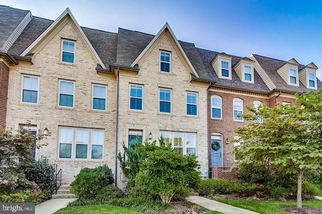 16125 Redland Rd, Rockville, MD 20855 - view of property featuring brick siding and a shingled roof