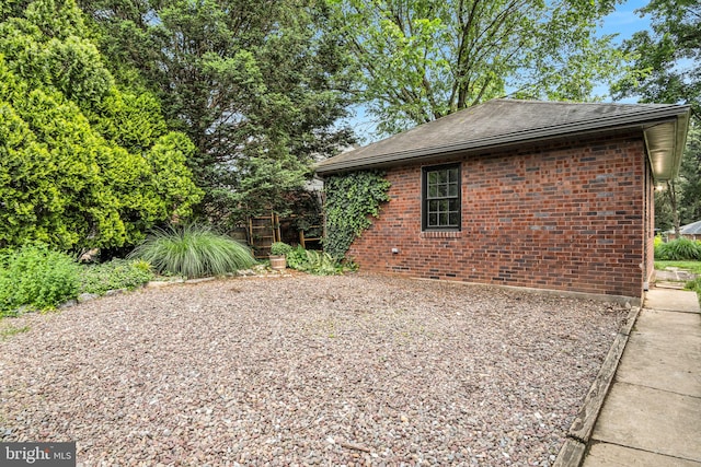 302 Bailey St, New Cumberland, PA 17070 - view of side of property featuring brick siding and roof with shingles