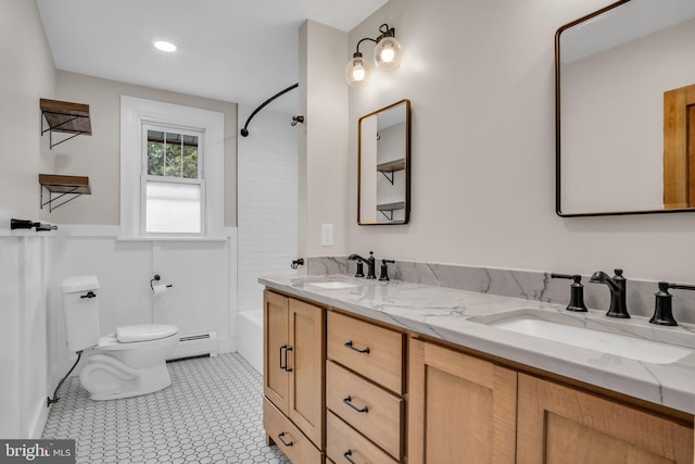 302 Bailey St, New Cumberland, PA 17070 - bathroom featuring a baseboard radiator, double vanity, and tub / shower combination