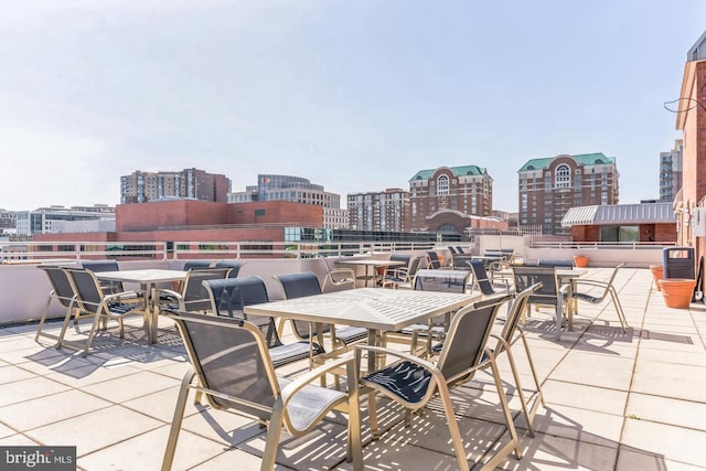 1024 N Utah St Unit 422, Arlington, VA 22201 - view of patio featuring a city view and outdoor dining space