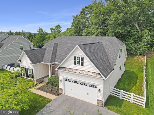 4714 De Invierno, Mount Airy, MD 21771 - view of front of home featuring a standing seam roof, roof with shingles, stone siding, driveway, and a metal roof