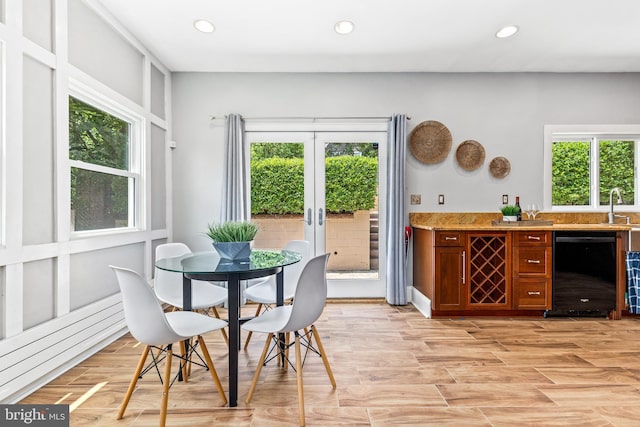 3010 26th St NE, Washington, DC 20018 - dining area with a bar, recessed lighting, light wood-style floors, and french doors