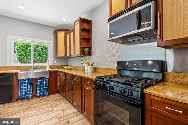 3010 26th St NE, Washington, DC 20018 - kitchen with black appliances, open shelves, decorative backsplash, light stone countertops, and light wood finished floors