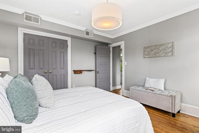 3010 26th St NE, Washington, DC 20018 - bedroom featuring wood finished floors, crown molding, and a closet