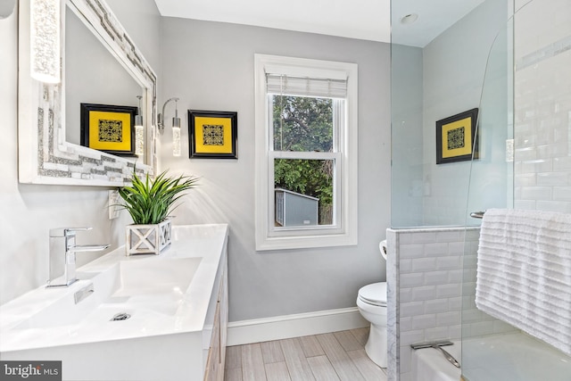 3010 26th St NE, Washington, DC 20018 - full bath with double vanity, shower / bath combination, and wood finished floors