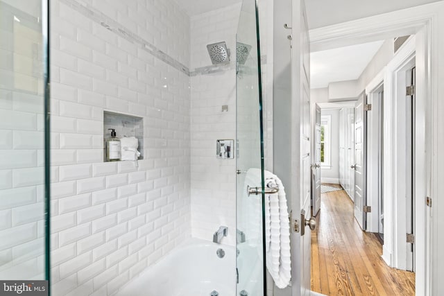 3010 26th St NE, Washington, DC 20018 - full bathroom featuring washtub / shower combination and wood-type flooring