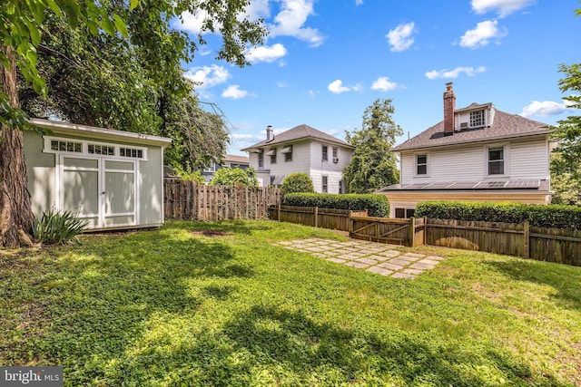 3010 26th St NE, Washington, DC 20018 - fenced backyard with a shed and a patio area