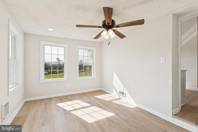 1611 Hudson Hollow Rd, Stephens City, VA 22655 - unfurnished room with wood finished floors, a textured ceiling, and ceiling fan