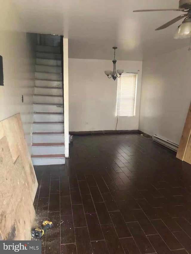 2914 Rutledge St, Philadelphia, PA 19134 - unfurnished living room with baseboard heating, a ceiling fan, a chandelier, baseboards, and wood finished floors