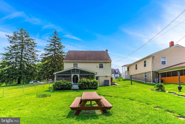 5208 Arbutus Ave, Baltimore, MD 21227 - rear view of house with a sunroom and central AC