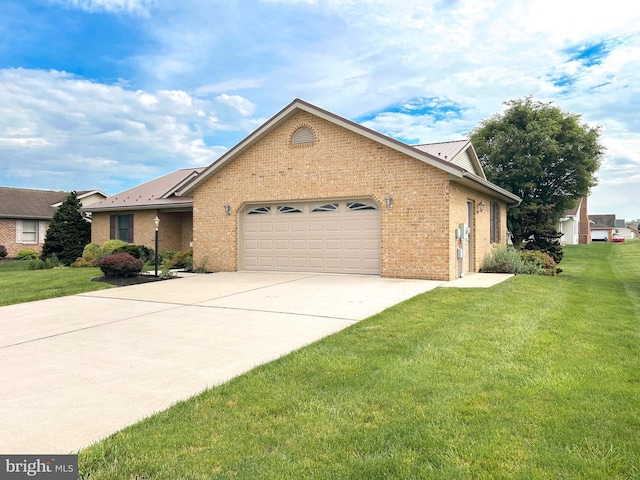 60 Parkwood Dr, Greencastle, PA 17225 - ranch-style house featuring a garage, concrete driveway, brick siding, and a front lawn