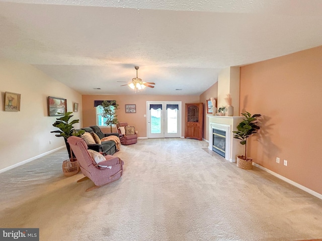 60 Parkwood Dr, Greencastle, PA 17225 - living area with carpet flooring, baseboards, a fireplace with flush hearth, and vaulted ceiling