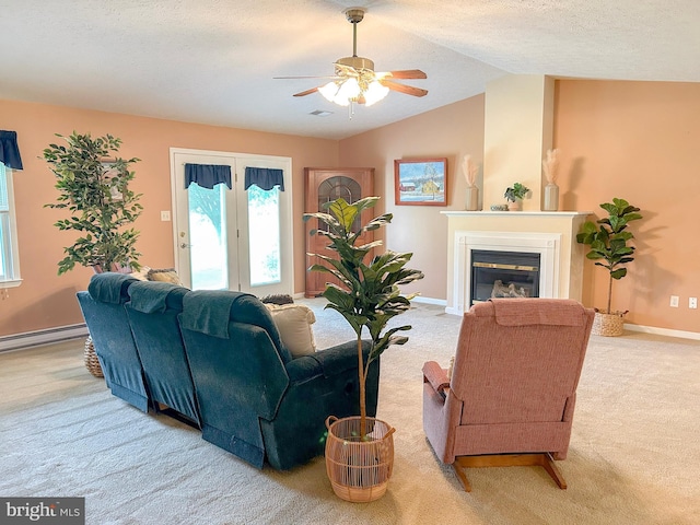 60 Parkwood Dr, Greencastle, PA 17225 - living room with carpet, a ceiling fan, a glass covered fireplace, a baseboard radiator, and baseboards