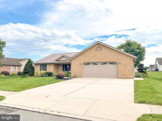 60 Parkwood Dr, Greencastle, PA 17225 - ranch-style home with brick siding, an attached garage, concrete driveway, and a front yard