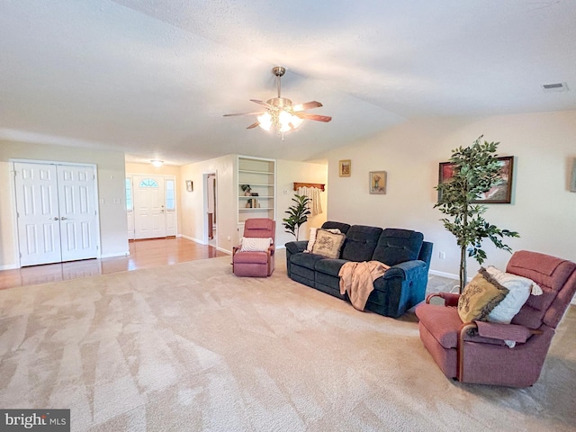 60 Parkwood Dr, Greencastle, PA 17225 - carpeted living room with ceiling fan, baseboards, and lofted ceiling