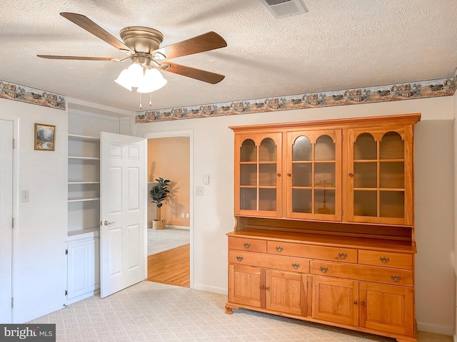 60 Parkwood Dr, Greencastle, PA 17225 - unfurnished dining area featuring a ceiling fan, a textured ceiling, baseboards, and light colored carpet