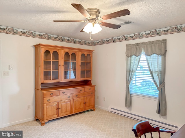 60 Parkwood Dr, Greencastle, PA 17225 - sitting room with a baseboard heating unit, a ceiling fan, a textured ceiling, light carpet, and baseboards