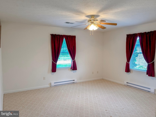 60 Parkwood Dr, Greencastle, PA 17225 - unfurnished room featuring baseboard heating, plenty of natural light, a ceiling fan, and a textured ceiling