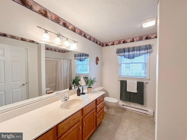 60 Parkwood Dr, Greencastle, PA 17225 - full bathroom with a baseboard radiator, toilet, a textured ceiling, plenty of natural light, and vanity