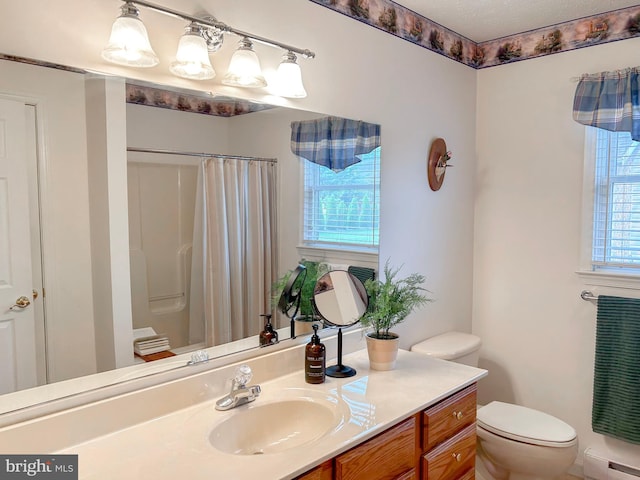 60 Parkwood Dr, Greencastle, PA 17225 - bathroom featuring a baseboard heating unit, toilet, vanity, and a shower with shower curtain