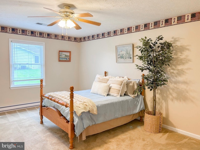 60 Parkwood Dr, Greencastle, PA 17225 - bedroom featuring light carpet, baseboard heating, baseboards, a textured ceiling, and ceiling fan