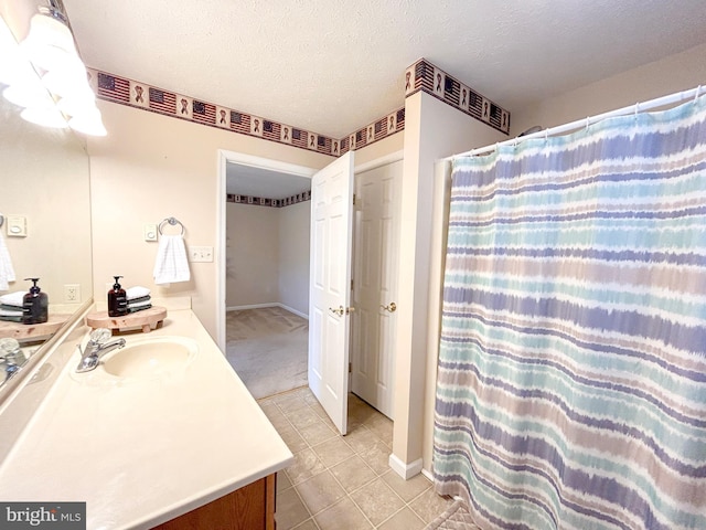 60 Parkwood Dr, Greencastle, PA 17225 - full bathroom featuring vanity, tile patterned floors, curtained shower, a textured ceiling, and baseboards
