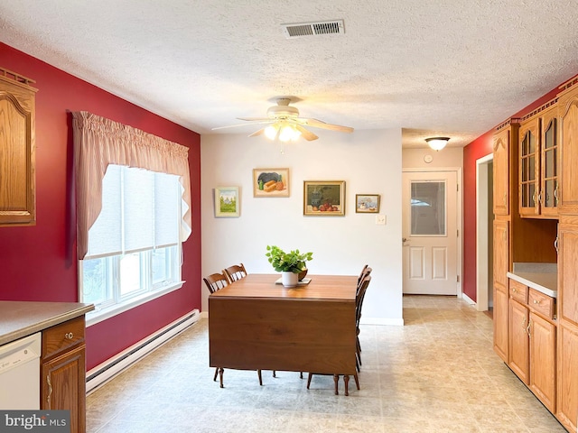 60 Parkwood Dr, Greencastle, PA 17225 - dining area with baseboard heating, ceiling fan, a textured ceiling, and baseboards