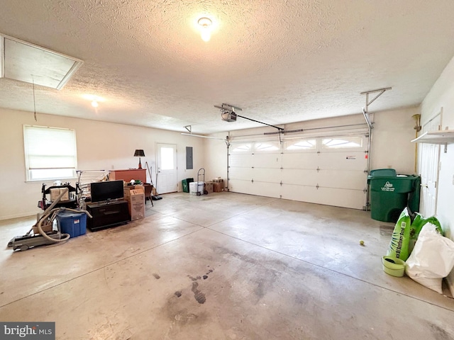 60 Parkwood Dr, Greencastle, PA 17225 - garage featuring a garage door opener and electric panel