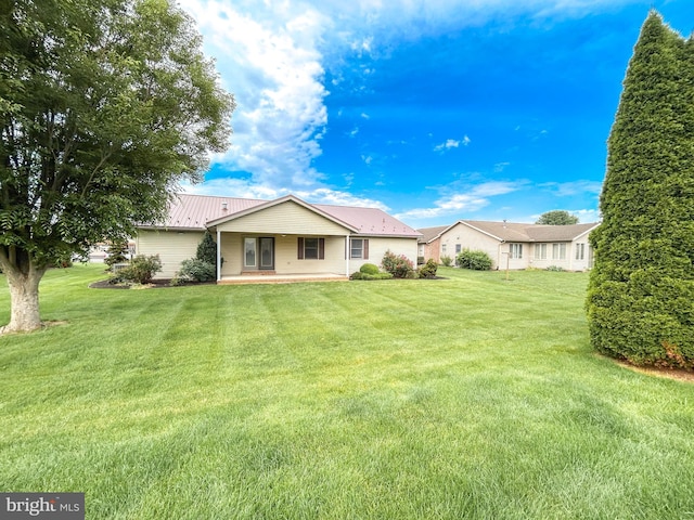 60 Parkwood Dr, Greencastle, PA 17225 - rear view of property with a lawn and metal roof