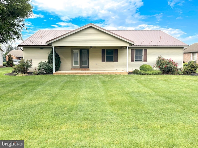 60 Parkwood Dr, Greencastle, PA 17225 - back of property featuring metal roof, a yard, and a porch