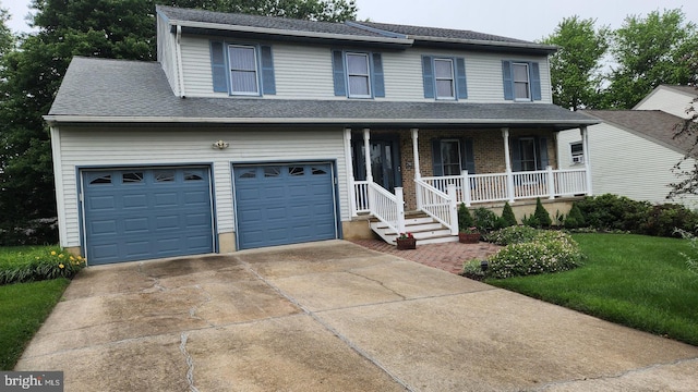 13 Firechase Cir, Newark, DE 19711 - view of front of property featuring covered porch, a garage, concrete driveway, a front yard, and roof with shingles