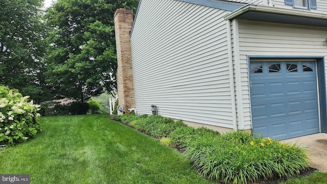 13 Firechase Cir, Newark, DE 19711 - view of side of property featuring a lawn and a garage