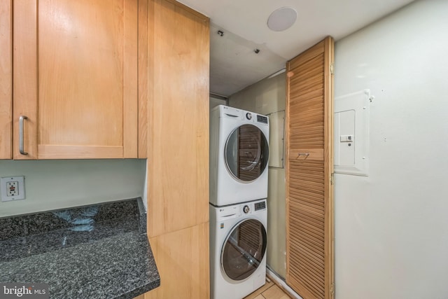 1520 16th St NW Unit 101, Washington, DC 20036 - laundry room with stacked washing machine and dryer and electric panel