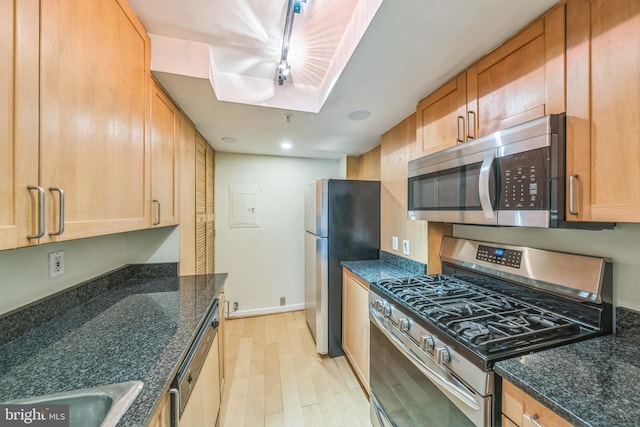 1520 16th St NW Unit 101, Washington, DC 20036 - kitchen featuring appliances with stainless steel finishes, light wood-style flooring, dark stone countertops, recessed lighting, and electric panel