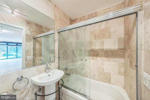 1520 16th St NW Unit 101, Washington, DC 20036 - bathroom featuring combined bath / shower with glass door and tile walls